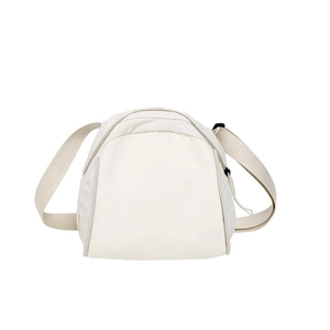Minimalist cream white canvas crossbody bag with semi-circular design and adjustable strap