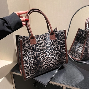 Large leopard print tote bag with brown leather straps for autumn winter fashion look