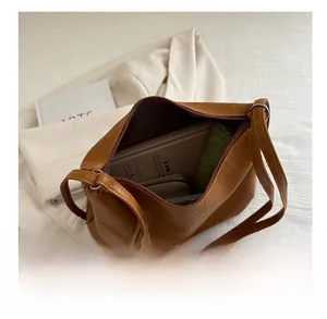 Top view of spacious brown PU leather tote bag showing large interior storage space