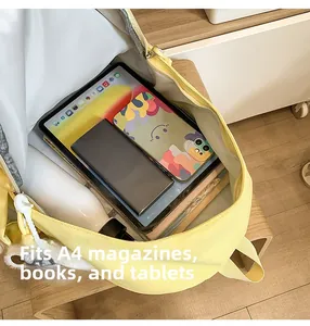 Detailed interior of yellow backpack showing space for A4 books and tablets