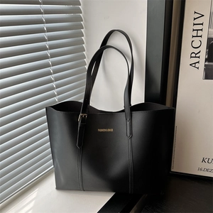 Minimalist black matte leather tote bag for women with golden Fashion & Bags logo lettering