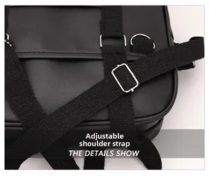 Detail showing adjustable black fabric shoulder strap with silver metal buckle on a handbag