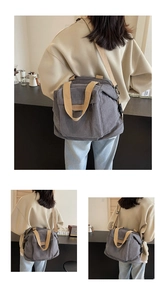 Detail of grey corduroy tote bag with FASHION leather patch and canvas shoulder strap