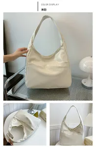 Detailed close-up showing the glossy texture and sleek design of the beige hobo shoulder bag