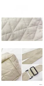 Detail view of beige quilted tote bag showing fine stitching and adjustable shoulder strap