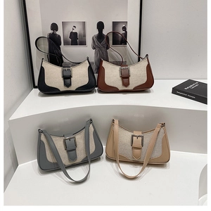 Four baguette shoulder bags in canvas and faux leather with metal buckle details