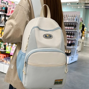 Off-white and light blue nylon backpack with honeycomb texture and outdoor embroidery