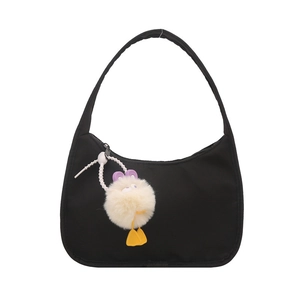 Minimalist black crescent hobo shoulder bag with a cute plush monster charm