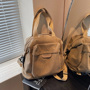 Brown corduroy tote bag with FASHION label and adjustable strap for daily use