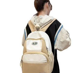 Minimalist beige nylon backpack with breathable mesh and retro badge for women travel