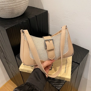 Minimalist beige baguette shoulder bag with leather trim and silver buckle accent