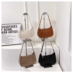 Detailed display of vintage half-moon underarm bags in cream, brown, khaki, and black colors