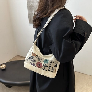 Fashionable cream canvas and PU hobo bag with colorful woven floral patchwork panel