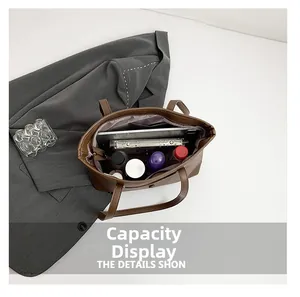 Capacity display of coffee leather tote bag with interior compartments for essentials