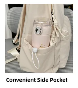 Detail view of the beige backpack featuring a side pocket with drawstring and water bottle