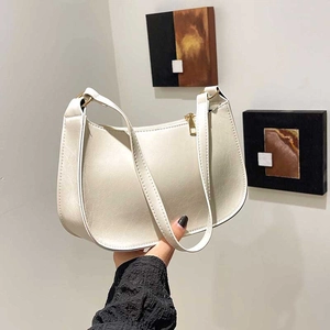 Chic cream faux leather baguette bag with vintage pleated texture and gold zipper