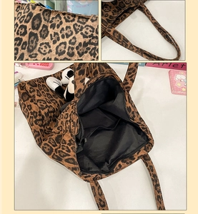 Detailed view of leopard print tote bag fabric and internal zippered compartment