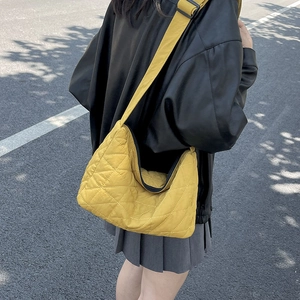 Bright yellow quilted puffer tote bag in minimalist Korean style for casual streetwear