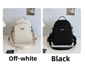 Detailed comparison of minimalist cream and black backpacks in textured nylon fabric