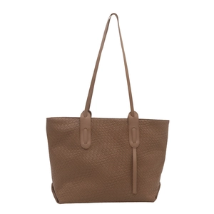Brown woven texture tote bag with long shoulder straps and spacious trapezoidal design