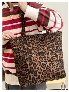 Detailed close-up of a large leopard print tote bag with thick durable canvas material