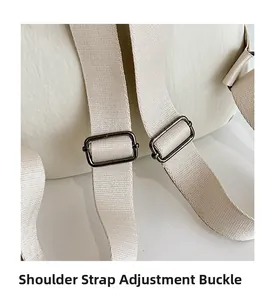 Macro detail of adjustable shoulder strap buckles on cream nylon travel backpack
