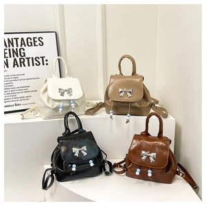 Mini butterfly backpacks in four colors with pearl drawstring and silver metal bow detail