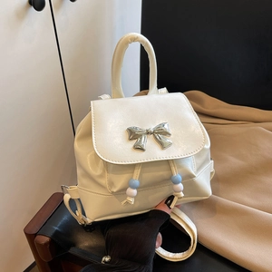 White mini PU leather backpack with silver butterfly detail and adjustable straps