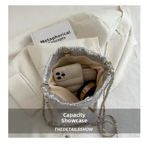 Silver sequin bucket bag detail showing internal capacity for phone and cosmetics