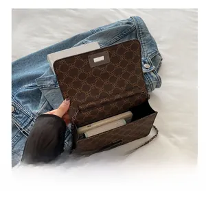 Detail of the vintage monogram crossbody bag interior with large capacity space