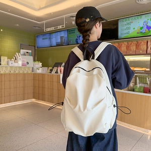 Minimalist white campus backpack with adjustable side drawstrings and reinforced straps