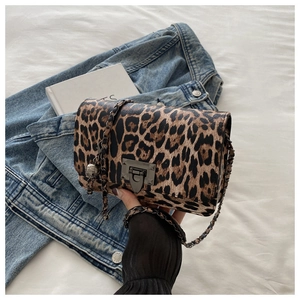 Detailed view of leopard print crossbody bag with metallic chain and stylish gunmetal lock