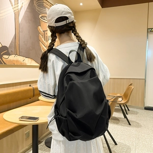 Minimalist black high-capacity Japanese style school backpack with large main compartment