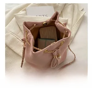 Pink bucket bag interior showing smartphone capacity and metal magnetic closure