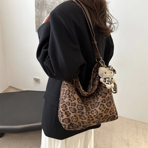 Chic leopard print large capacity shoulder bag with brown leather strap and plush cat charm