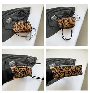Detail views of leopard print handbag showing double handles and metal hardware