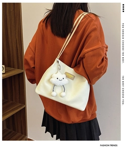 White corduroy tote bag with dual straps, brown leather logo, and cute cloud charm