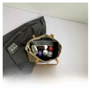 Top view of spacious canvas tote interior showing ample storage for tablets and gadgets