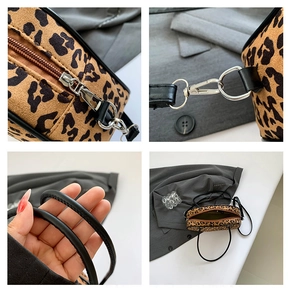 Detail view of leopard print handbag showing silver zipper and metallic buckles