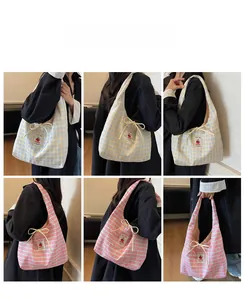 Detailed views of plaid canvas tote bags with cute bow tie and cherry label detail