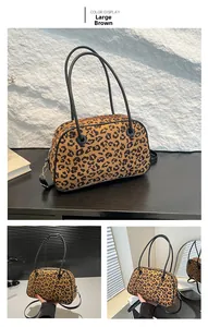 Detailed views of brown leopard print handbag with sturdy handles and long strap