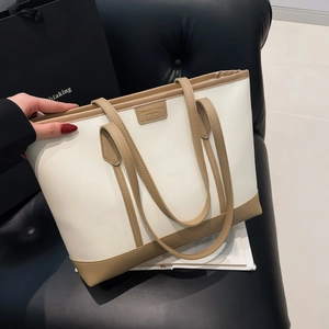 Minimalist large tote bag in white and brown leather patchwork for stylish office commuting