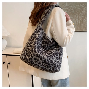 Detail view of the soft leopard print plush tote bag showing large capacity and fuzzy texture