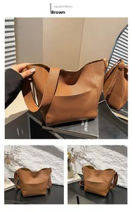 Detail view of brown lychee texture leather bucket bag with shoulder strap and pocket