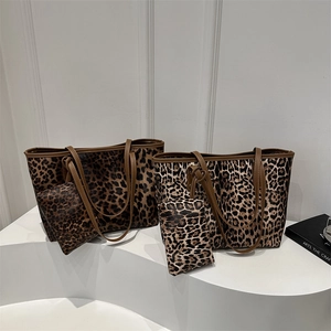 Fashionable leopard print tote bag and small pouch set with brown handles on white display