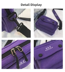 Detail view of purple canvas crossbody bag showing dual zippers and D C Y logo branding