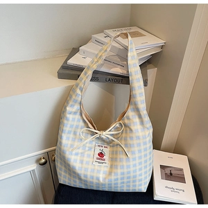 Blue and yellow checkered canvas tote bag with tomato patch and decorative bow