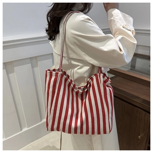 Red and white striped canvas tote bag showing its large capacity and durable double straps
