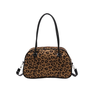 Classic leopard print tote bag with black handles and silver metal hardware in a flat lay view