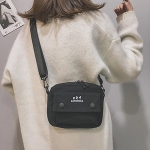Minimalist black canvas crossbody bag for women with adjustable strap and DCY embroidery
